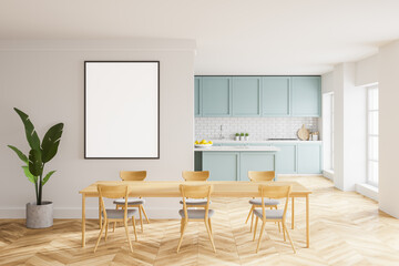 Whte and blue kitchen with table and poster