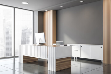 Gray and wooden CEO office corner