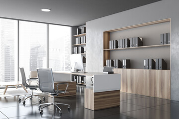 Fototapeta na wymiar Gray and wooden CEO office corner with bookcase