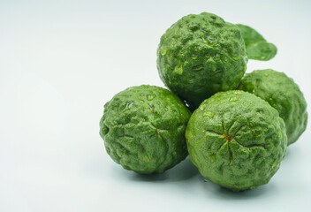 Fresh bergamot fruit with leaf and cut in half of bergamot on white background