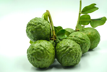 Fresh bergamot fruit with leaf and cut in half of bergamot on white background