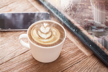 Coffee cup on a rainy day window background