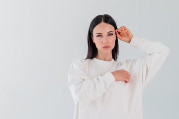 Portrait beautiful adult sports girl model on white background. hoody. logo.