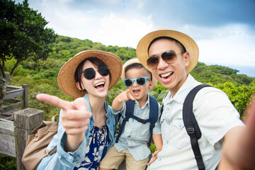 happy asian Family On Hiking Adventure and taking selfie