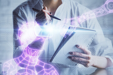 Fototapeta premium AR hologram over woman's hands taking notes background. Concept of augmented reality. Multi exposure
