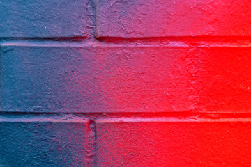 Beautiful bricks colorful street art graffiti background. Abstract gradient spray drawing fashion colors on the brick walls of the city. Urban  orange , pink , purple , crimson, blue texture