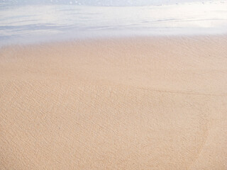 Fototapeta na wymiar close up sand with wave of sea beach