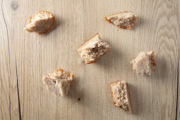 Bread crumbs on a wooden table.
