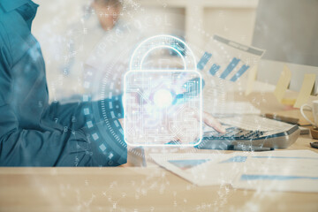 Multi exposure of lock icon with man working on computer on background. Concept of network protection.