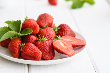 Beautiful juicy fresh strawberries on the concrete surface of the table