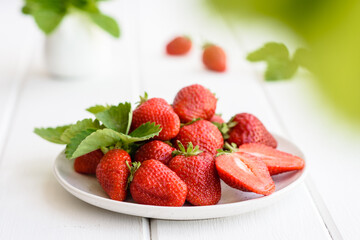 Beautiful juicy fresh strawberries on the concrete surface of the table