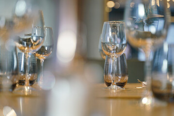polished glass of wine on a dining table
