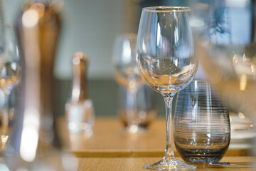 polished glass of wine on a dining table
