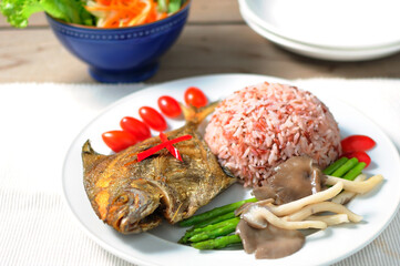 Healthy rice Fried Fish with mushrooms and asparagus boiled