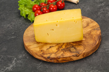 Hard yellow tasty cheese brick