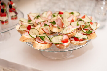 canapes with ham, fresh cucumber and cherry