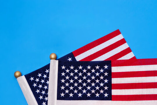 Two American Flags  in the light blue background