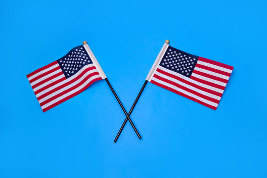 Two American Flags  in the light blue background