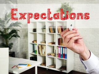 Motivation concept about Expectations with sign on the page.