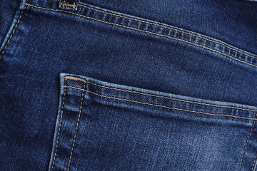 Fototapeta premium Close up of jeans fabric in a jeans pant. Jeans fabric texture.