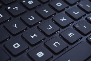 Close up of gaming laptop keyboard with futuristic font.