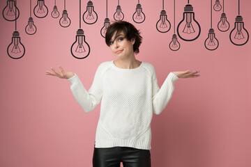 Beautiful woman with nothing to do gesture over cartoon drawn lamps. Girl using language of body to...