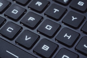 Close up of gaming laptop keyboard with futuristic font.