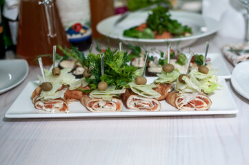 pancakes with salmon, olives and salad