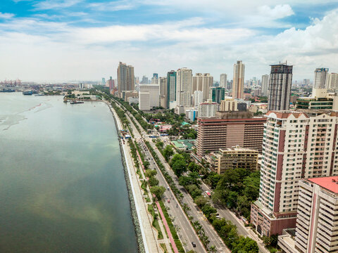 Manila, Philippines - June 2020: Roxas Boulevard, Manila Skyline and Manila Bay. Tall residential condominiums line the famous avenue.