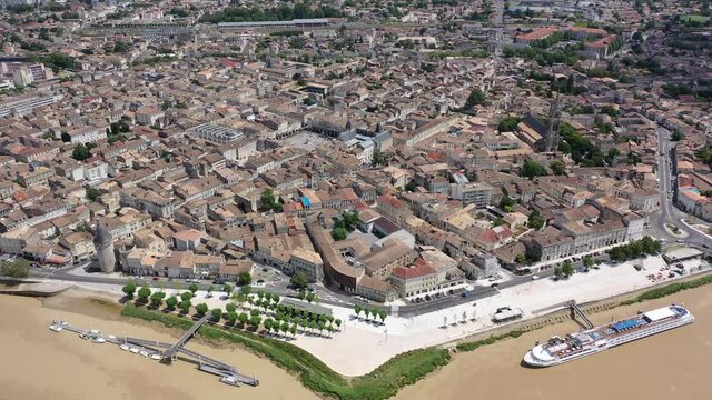 Panoramic aerial view of Libourne city on Dordogne river on sunny summer day, Gironde, France