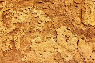 Texture of different layers of clay on the edge of a cliff. Closeup