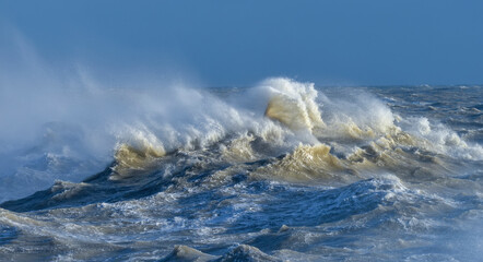 Amzing image of individual wave breaking and cresting during violent windy storm with superb wave...