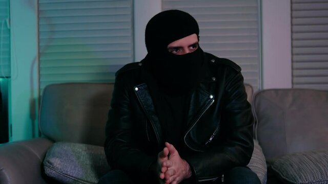 man with skimask inside