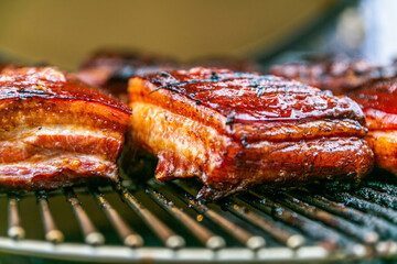 Fresh, delicious grilled meat. Grilling steak on BBQ. Close up view of grilling steak.