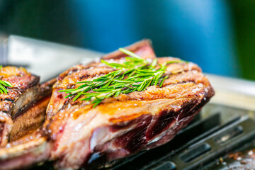 Fresh, delicious grilled meat. Grilling steak on BBQ. Close up view of grilling steak.