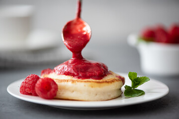 hot pancakes sprinkled with raspberry jam