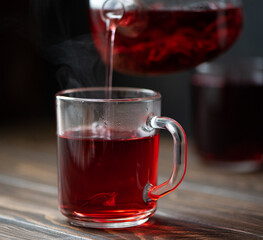 hot hibiscus tea in a glass teapot