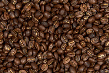 Caffeine, raw and agriculture concept. Close up roasted coffee beans background.