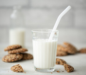 oatmeal cookies with seeds and nuts and a glass of milk