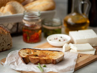 toasted piece of rye bread with feta cheese