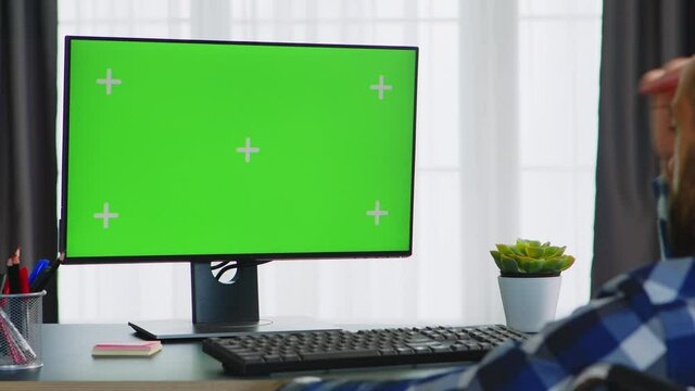 Disabled man in wheelchair looking at green screen. Handicapped invalid paralysed freelancer, immobilized entrepreneur working from home, ilness and disability