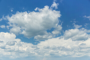 Naklejka na ściany i meble Clear blue sky with light, white clouds.