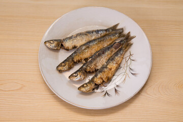 roasted or fried sardines on the plate