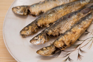 roasted or fried sardines on the plate