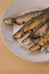 roasted or fried sardines on the plate
