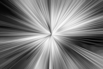 Abstract blurred black and white background with rays of light for use as a substrate or overlay template. Light burst from the center.