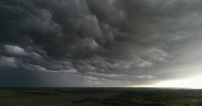 Aerial Dark ominous grey storm clouds. Dramatic sky. lighting in dark stormy clouds