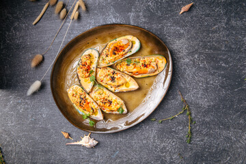 Top view dish with oysters on grey gackground