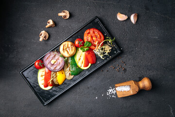 Grilled vegetables on dark background