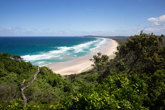 The perfect bay Tallow Beach at Byron Bay, picture taken from the walking path to the lighthouse at Byron Cape. Byron bay, New South Wales NSW, Australia, Oceania